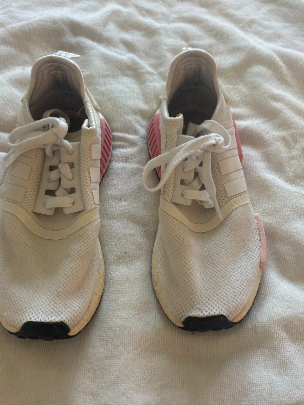 Used pink and white Adidas NMD R1 sneakers, size 5.